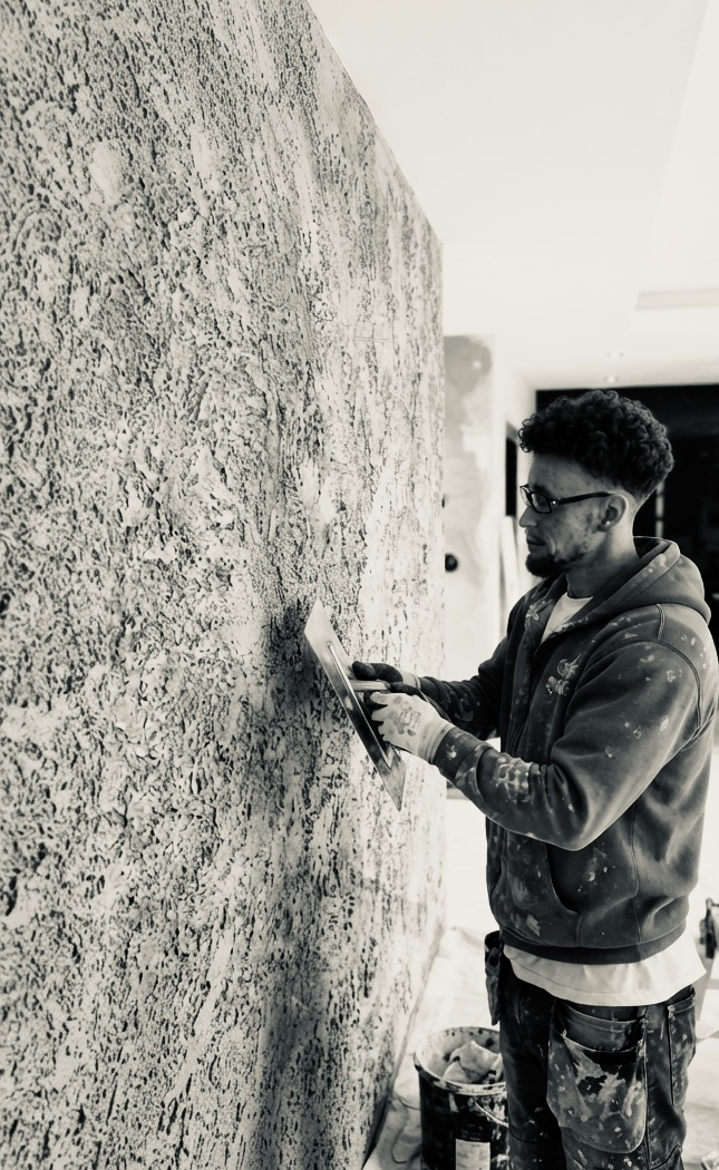 Calvin at work on a specialist wall finish